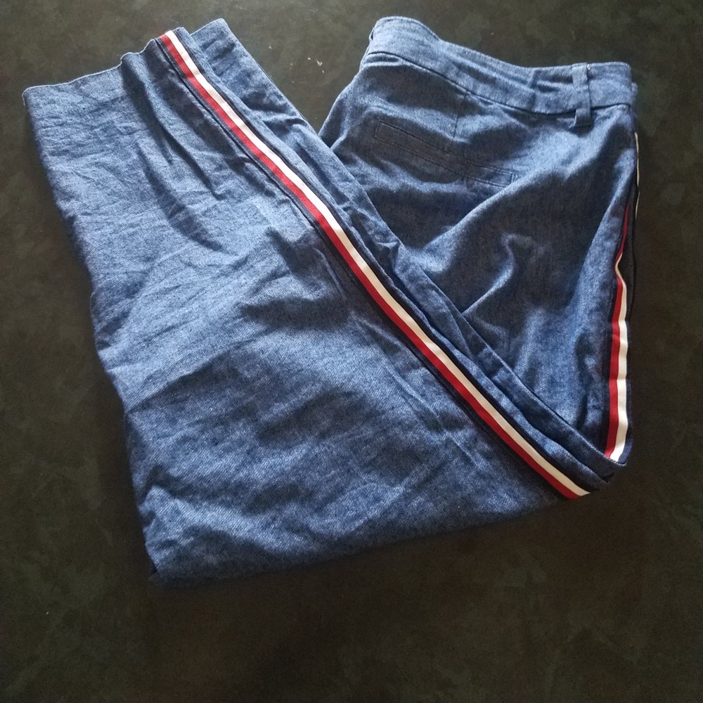 Blue pixie cut pants with red and white stripe
